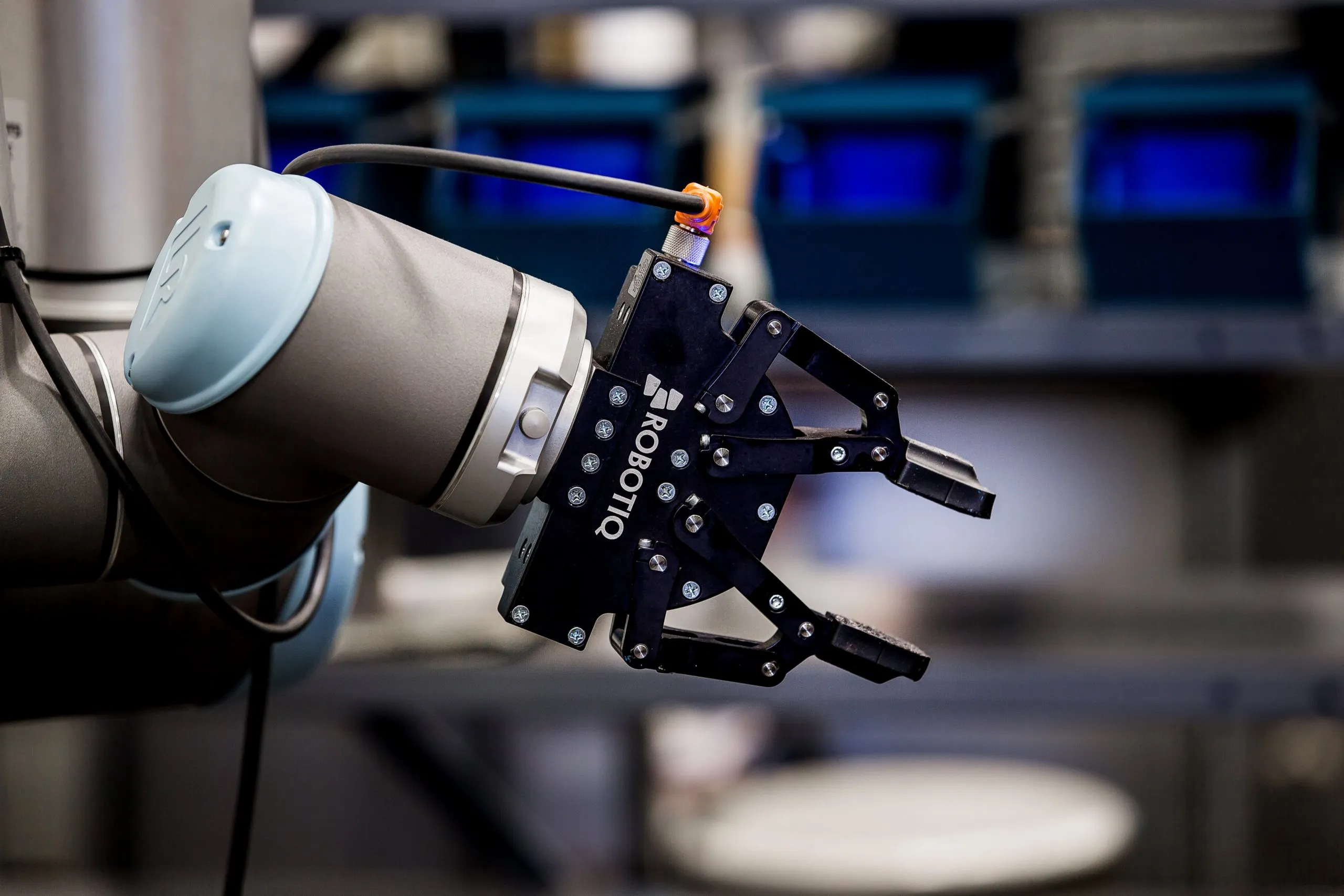 A robotic gripper on a robot arm in the shop