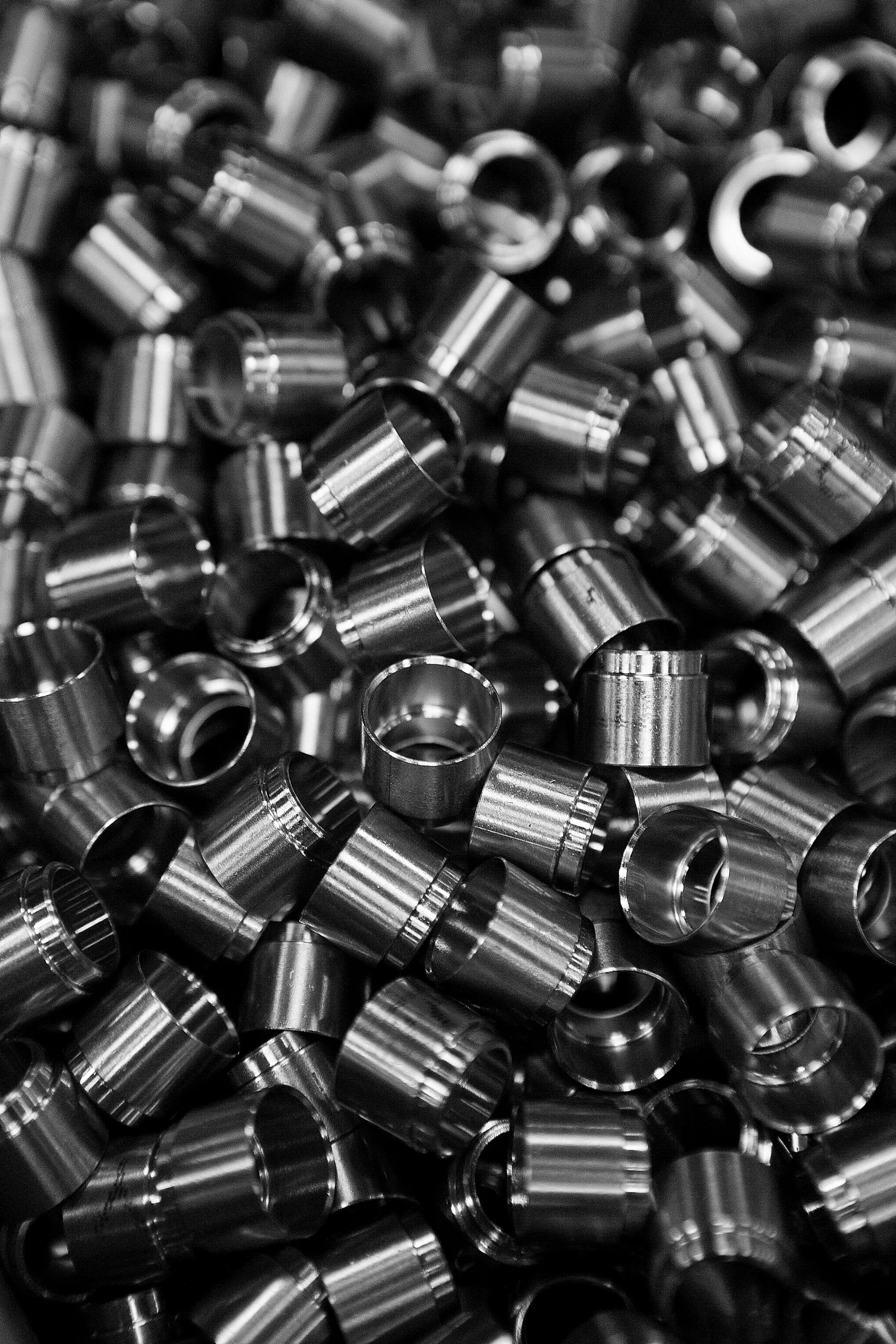 A pile of small machined steel parts