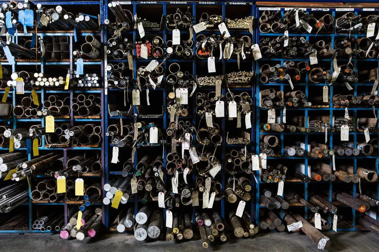 Racks of tagged metal bar stock