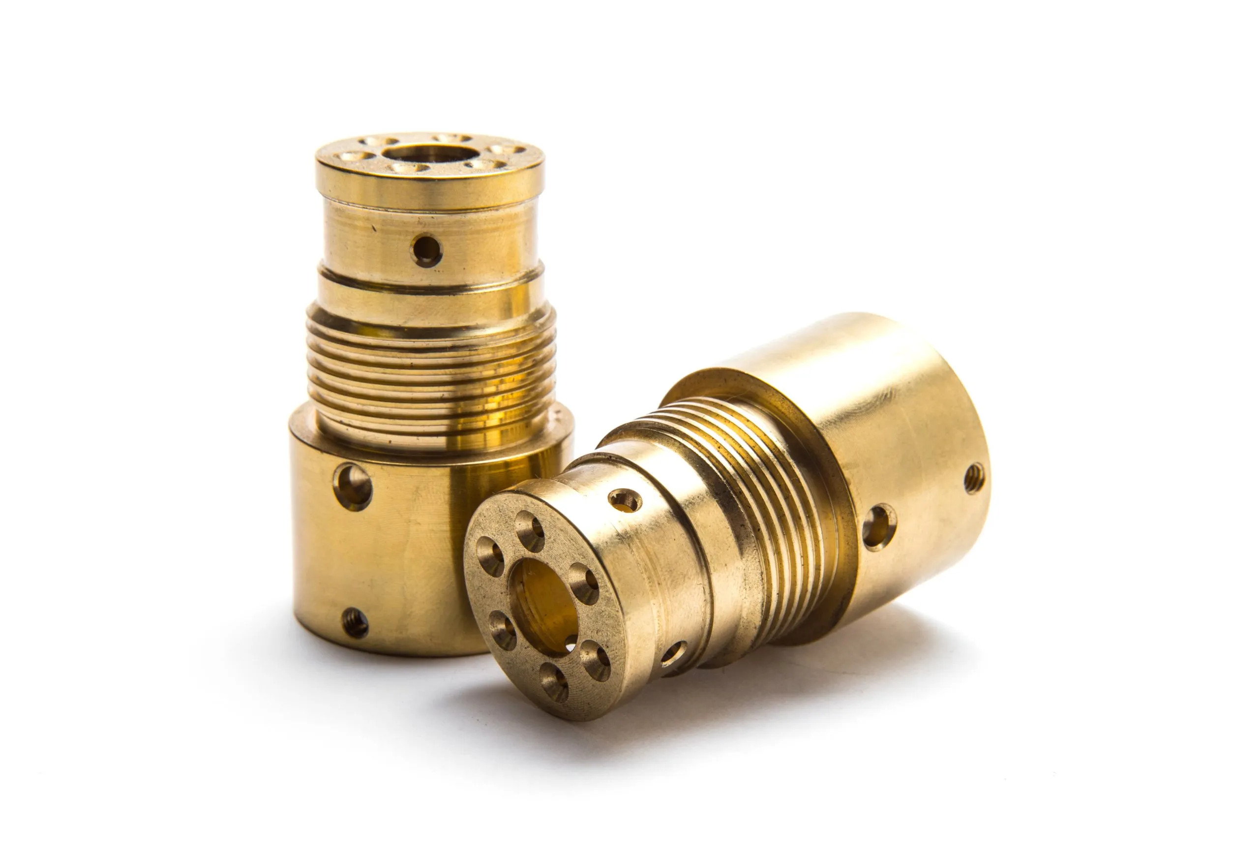 Two threaded brass parts photographed on white